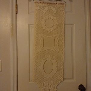 Vintage ecru Wall hanging. Metal hanger. Good vintage condition.